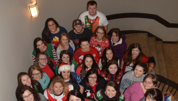 Group of people stand on stairs