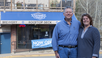 Photo of a couple standing outside a bar in Bryson City.