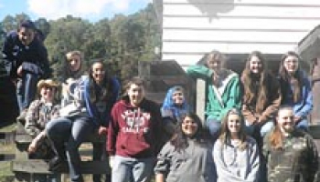 Photo of Jacob Barker (Swain County High School), Laurel Welch (Cherokee High School), Emily Alligood (Smoky Mountain High School), Autumn Farmer (Smoky Mountain High School) Tristin Bottchenbaugh (Cherokee High School), Karen Owens (president of STAR), Morgan Carpenter (Smoky Mountain High School), Alysia Figueroa (Smoky Mountain High School), Anya Walsh (Cherokee High School), Crystal Mathews (Franklin High School), Megan Beck (Smoky Mountain High School), Autumn Payne (Cherokee High School)