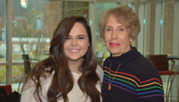 Two ladies pose for a photo inside SCC's Burrell Building in Sylva.