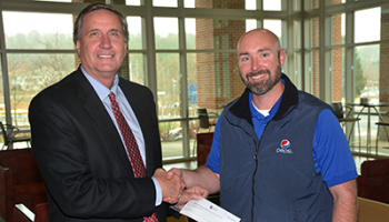 SCC president Dr. Don Tomas and Travis Ashe of Pepsi.