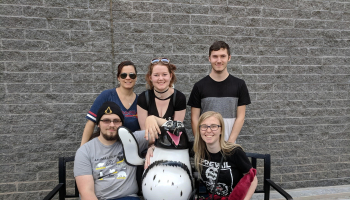 five students sitting