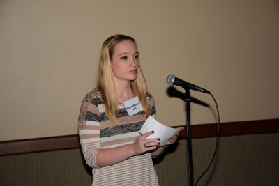 SCC student stands at a microphone asking a question of candidates during the Sept. 29 debate at SCC.