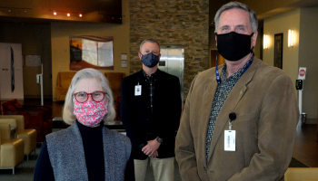 Joyce Lantz is pictured with Dr. Don Tomas and Brett Woods