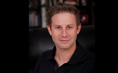 Man poses for portrait indoors