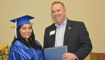 girl receiving diploma