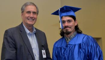Graduate receives diploma from SCC President