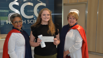 SCC student Karcee Dooley stands between representatives of the N.C. Nurses Honor Guard: Debbie Jones (left) and Doris Silvernell.