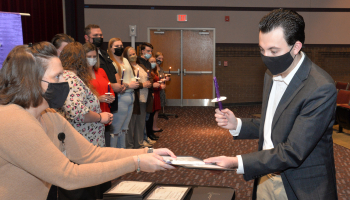 Student receives certificate