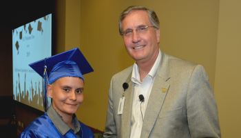 Graduate receives diploma
