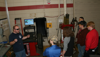 Students gathered around new equipment at Franklin High School