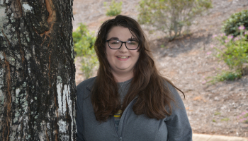 Young lady poses near a tree on SCC's Jackson Campus.