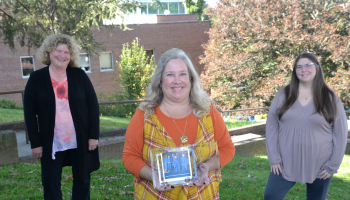 Three ladies stand outside on SCC's Jackson Campus