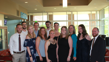 SCC physical therapist graduates pose for picture before their pinning ceremony