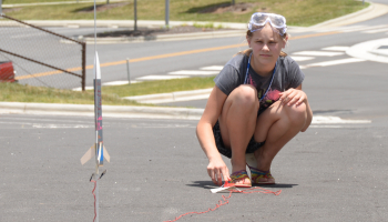 Girl launching her rocket
