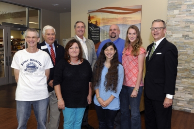 Five scholarship recipients stand with two college administrators and a Foundation board member inside a building on SCC's Jackson Campus.