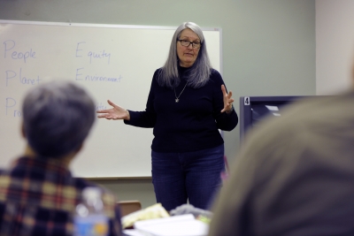 Photo of teacher talking to a class.