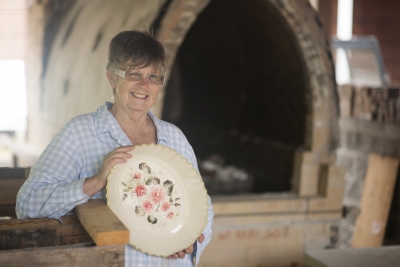 Woman holding pottery