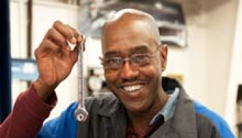 Photo of Stanley Kingsberry holding magnetic wrench
