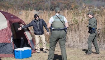 Role player engages with National Park Service recruits