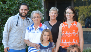 Nancy Kluttz and family pictured with scholarship recipient Evan Cann outside Harris Regional Hospital.