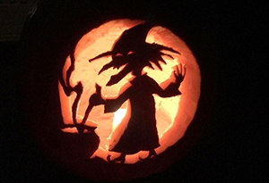 A witch carved into a pumpkin