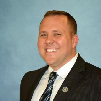 Man smiles for picture at SCC