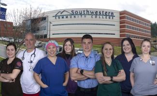 Harris Regional &amp; Swain Community Hospitals are offering a new “Healthcare Scholars” program that will provide last-dollar tuition and other financial support for SCC students in the Health Sciences fields represented in this photo. Pictured here are, from left: Ariel Chambers-Frizzell (Nurse Aide) of Sylva; Glenn Barnett (Nursing) of Robbinsville; Brittany Luker (Surgical Technology) of Cullowhee; Jordan Nelon (Medical Sonography) of Waynesville; Mitch Wike (EMS) of Cullowhee; Holly Parton (Respiratory The