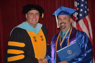 SCC president Dr. Don Tomas and SCC graduate Jesse Moore pictured at graduation in May 2017.