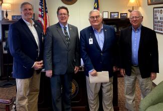 During a recent trip to Raleigh, Southwestern Community College officials met with State Senator Kevin Corbin (second from left). At left is Dr. Don Tomas, SCC President, and to Corbin’s right are Vance Davidson, Chair of SCC’s Board of Trustees; and Gerald McKinney, newly appointed member of SCC’s Board of Trustees.