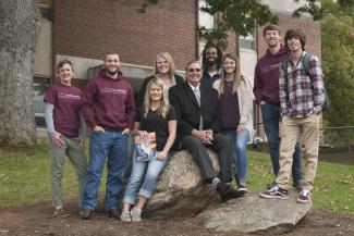 In this 2018 photo, Dr. Tomas is surrounded by SCC students on the Jackson Campus.